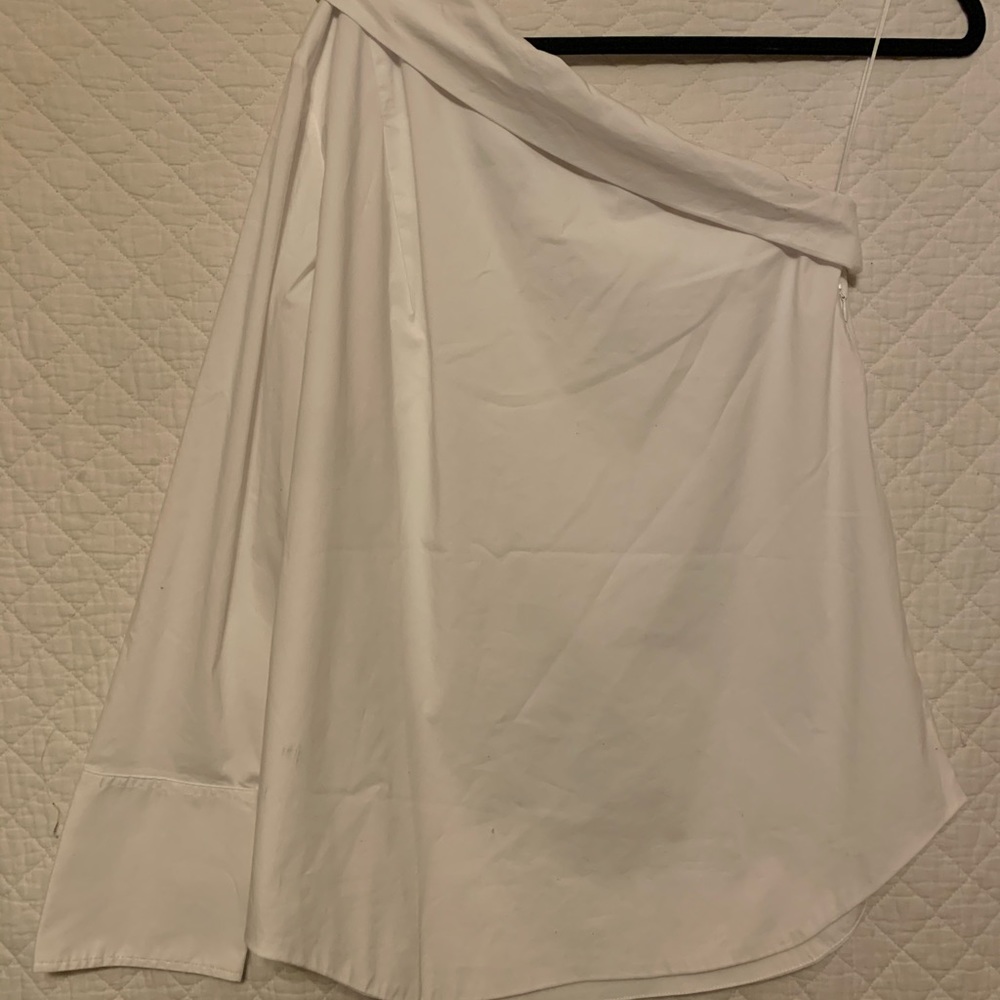 One shoulder white collared blouse.